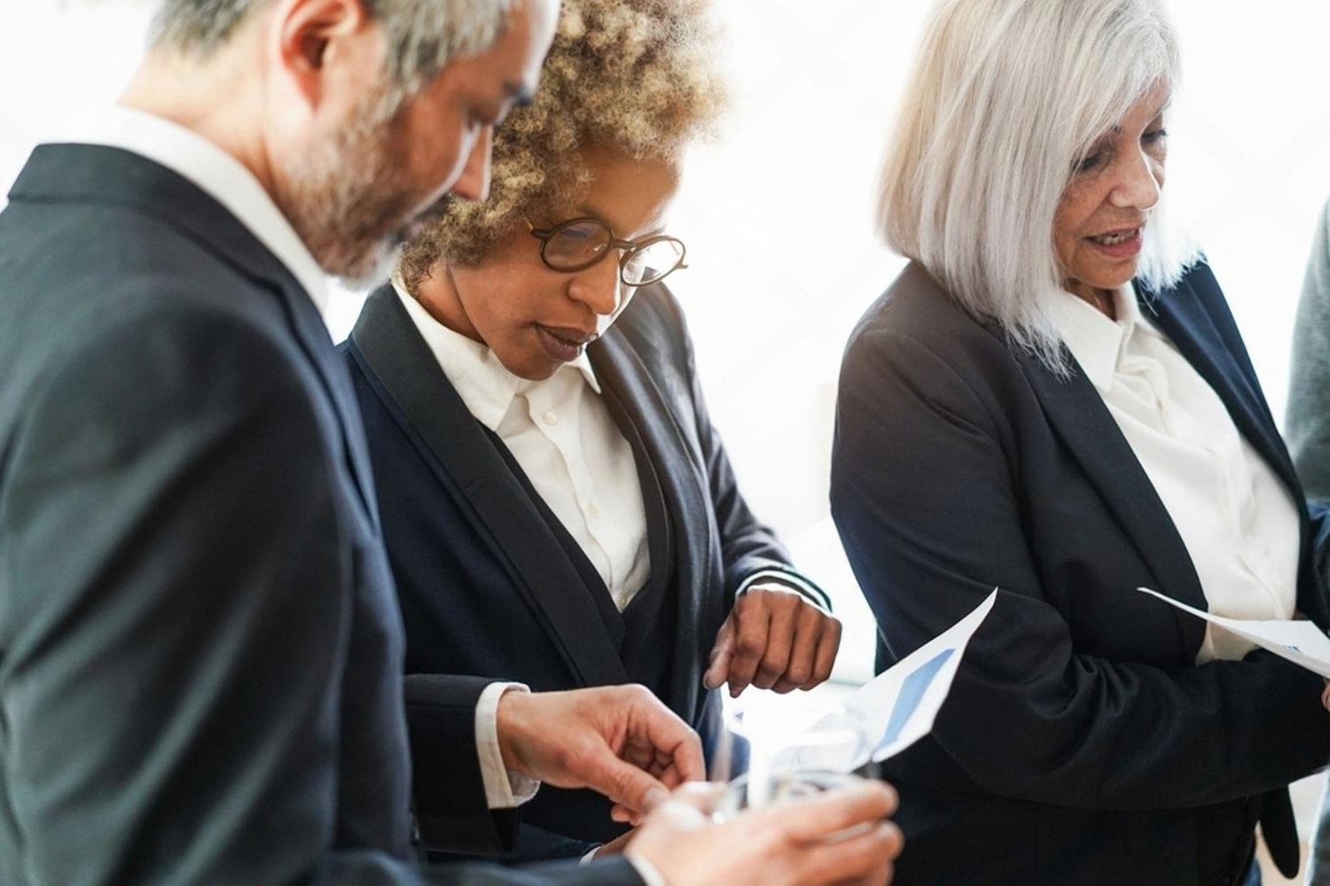 Forensic audit team reviewing documents during a corporate fraud investigation